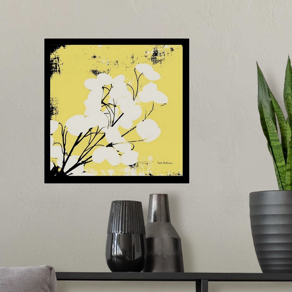 A modern room featuring Square silhouetted painting of a money plant in pale yellow, black, and white with a black boarder.