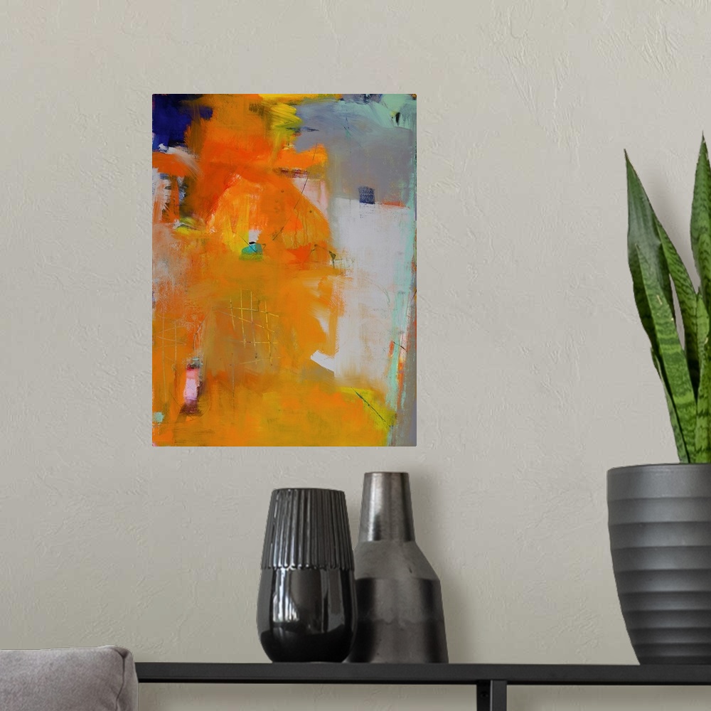 A modern room featuring Contemporary abstract painting in brilliant orange hues on a gray background.