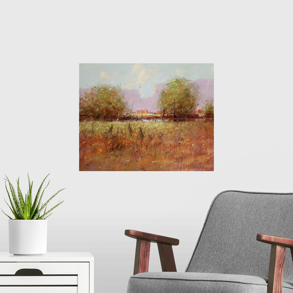 A modern room featuring A contemporary painting of a southwestern landscape with birds hiding in tall grass.