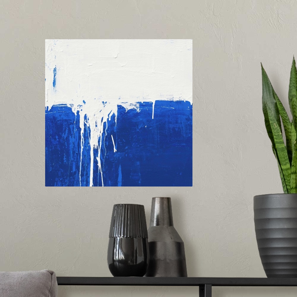 A modern room featuring Contemporary abstract colorfield painting using deep blue and white in a distressed style.