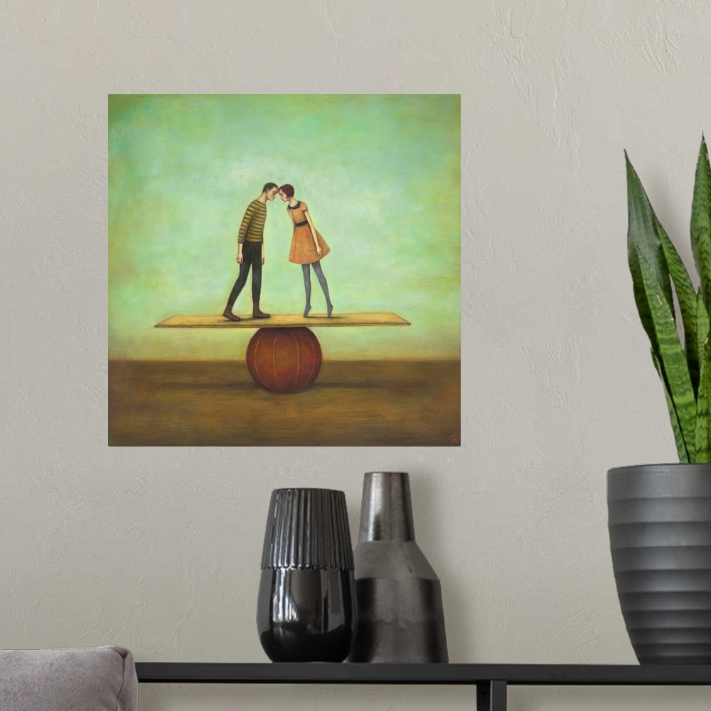 A modern room featuring Contemporary surreal artwork of a woman and man kissing on a plank balancing on a red ball.