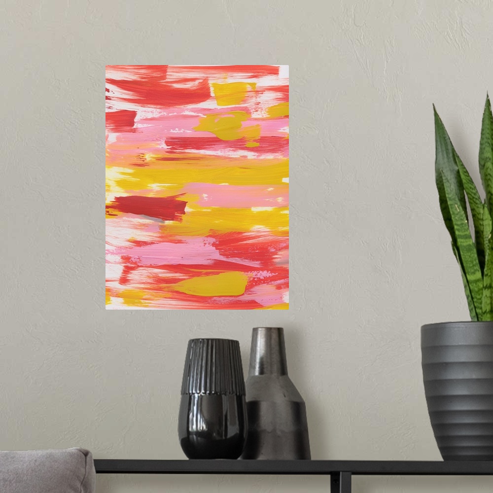A modern room featuring Vertical abstract painting of sweeping horizontal brush strokes in yellow, pink and red.