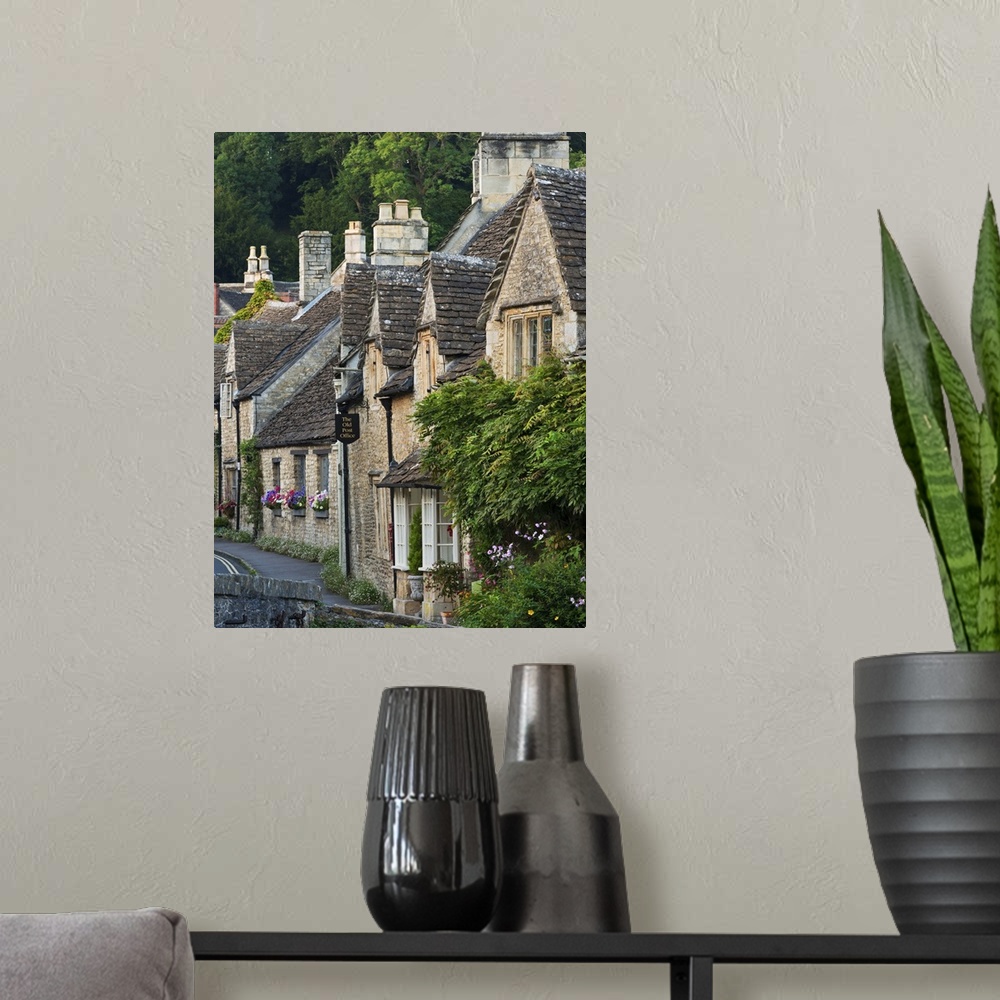 A modern room featuring Picturesque cottages in the beautiful Cotswolds village of Castle Combe, Wiltshire, England. Autu...