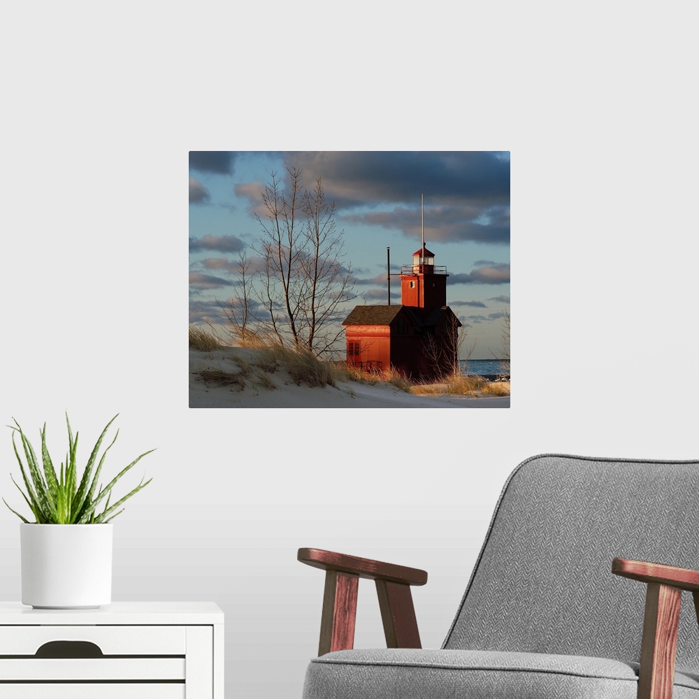 A modern room featuring Holland Michigan Lighthouse with a sunrise
