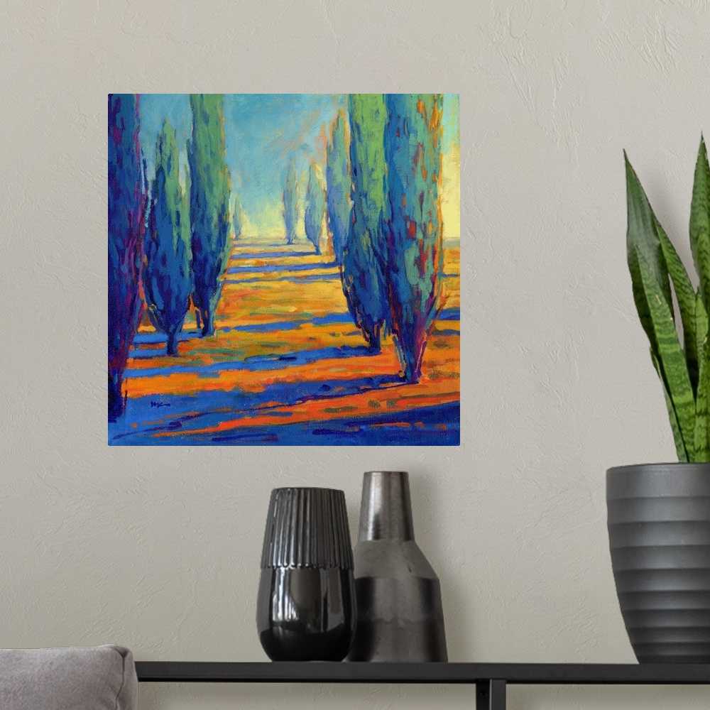 A modern room featuring A contemporary painting of a divide between a row of cypress trees.