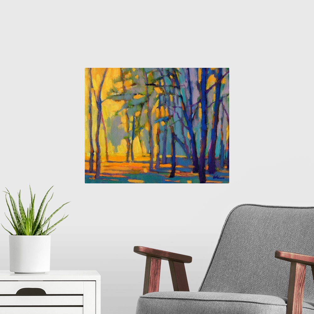 A modern room featuring Contemporary painting of trees in a forest with strong golden light shining through at golden hour.