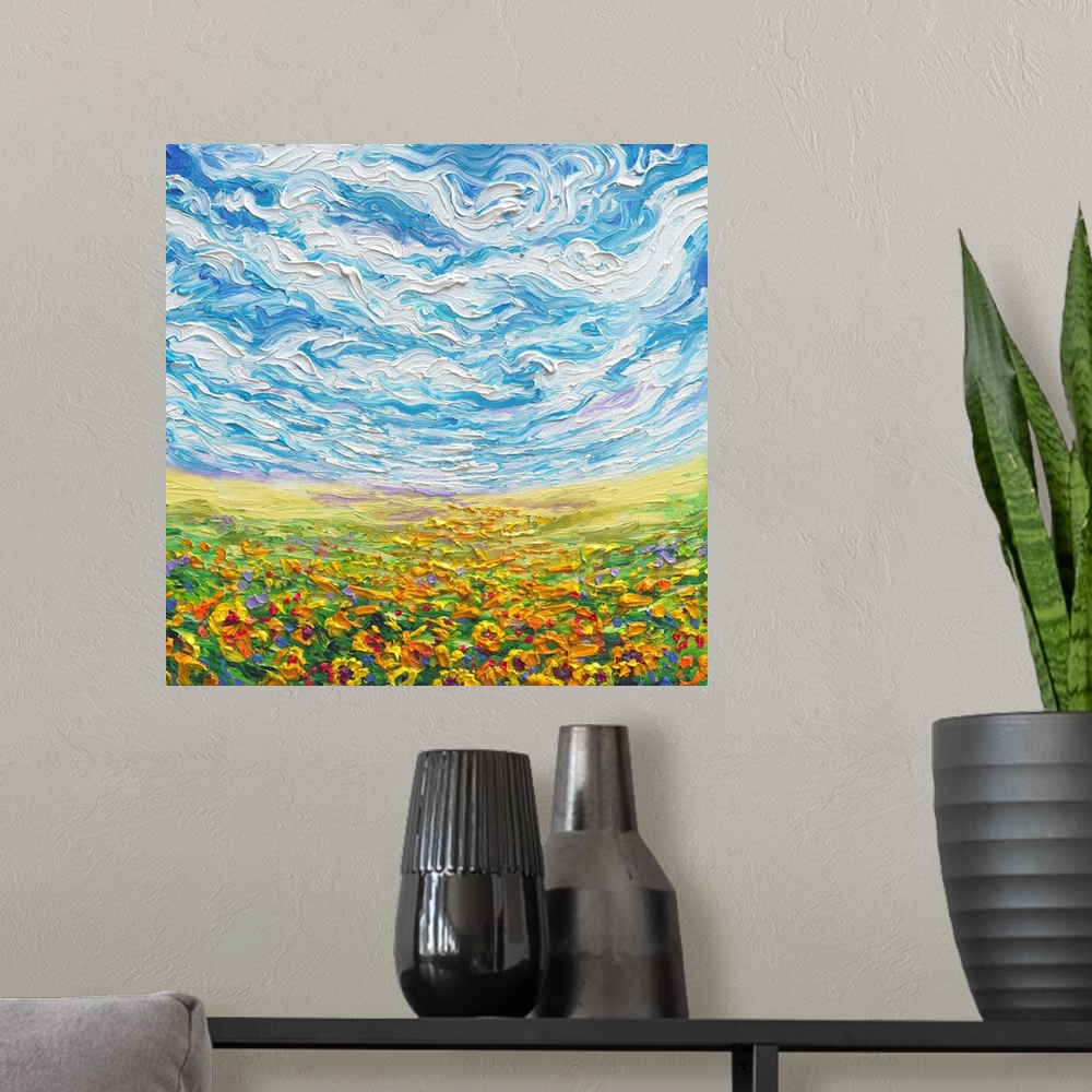 A modern room featuring Brightly colored contemporary artwork of a landscape with sunflower field.