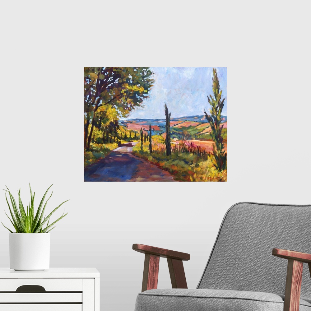 A modern room featuring Painting of a road through the Tuscan countryside.