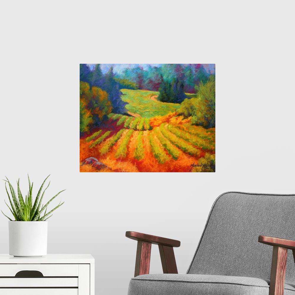 A modern room featuring Big painting on canvas of a  vineyard with a forest and rolling hills in the background.