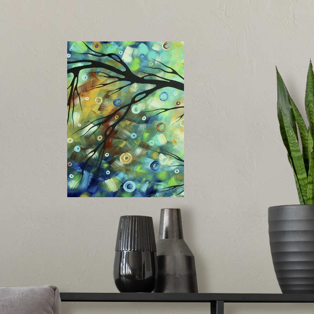 A modern room featuring Tall abstract painting of patches of color with the silohuette of a branch over top.