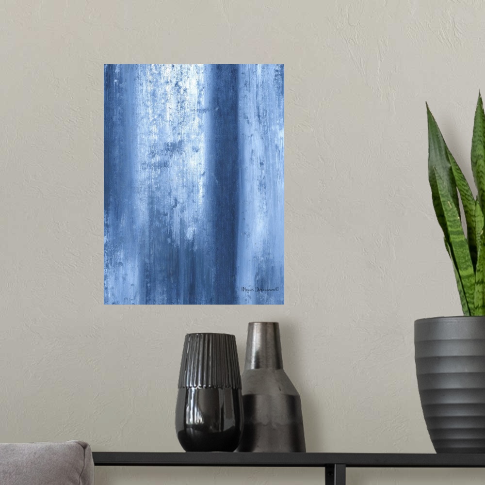 A modern room featuring A contemporary abstract painting that has fading blue tones and white running vertically and gent...