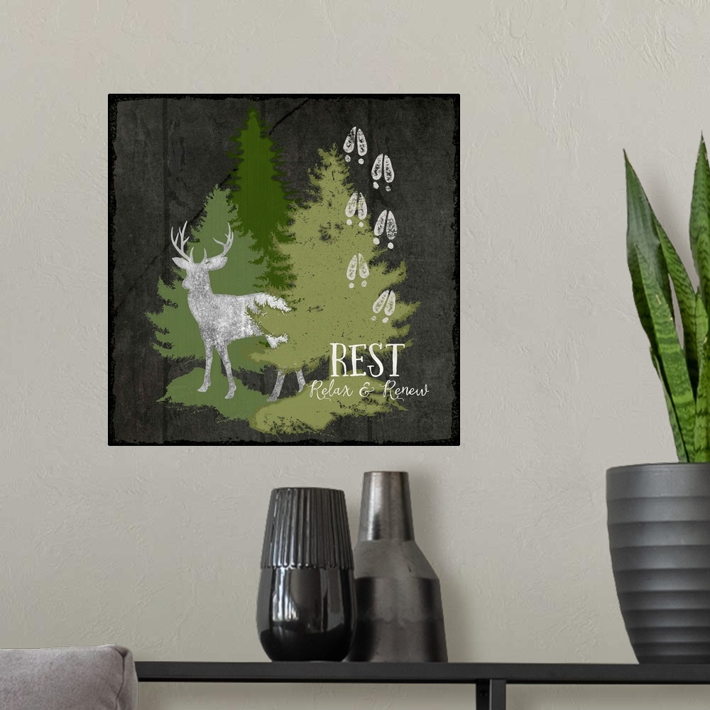 A modern room featuring Cabin decor of a deer silhouette with hoof tracks and pine trees.