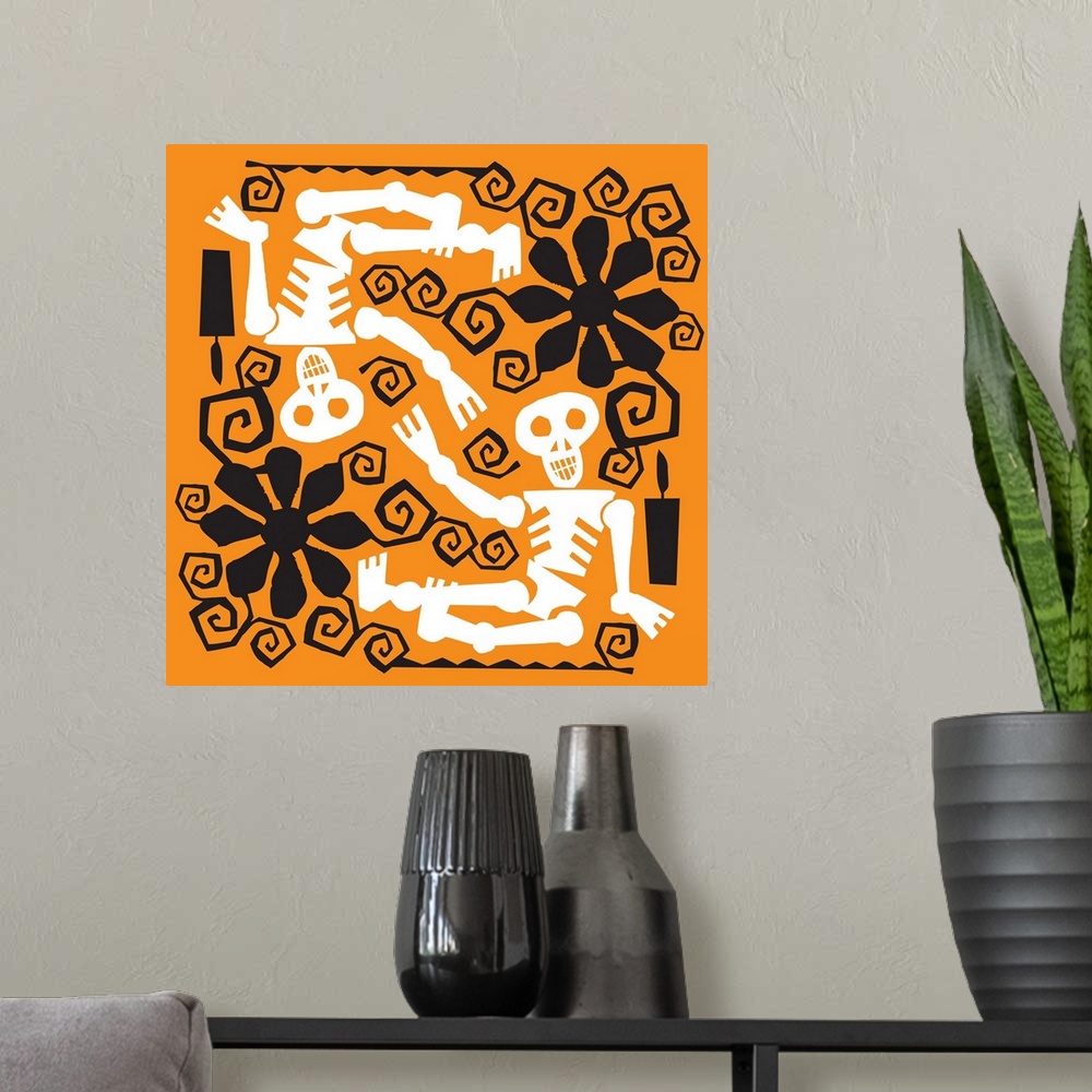 A modern room featuring Two skeletons with black flower designs on orange.