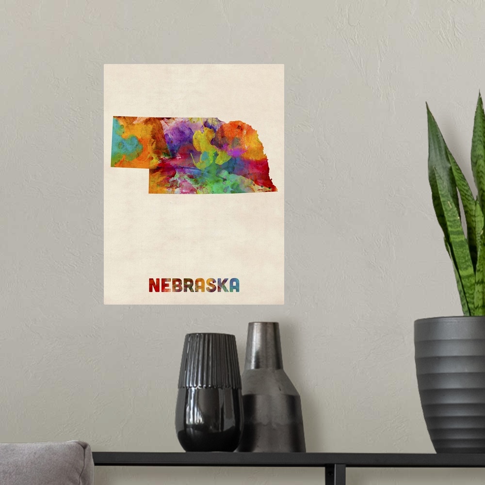 A modern room featuring Contemporary piece of artwork of a map of Nebraska made up of watercolor splashes.