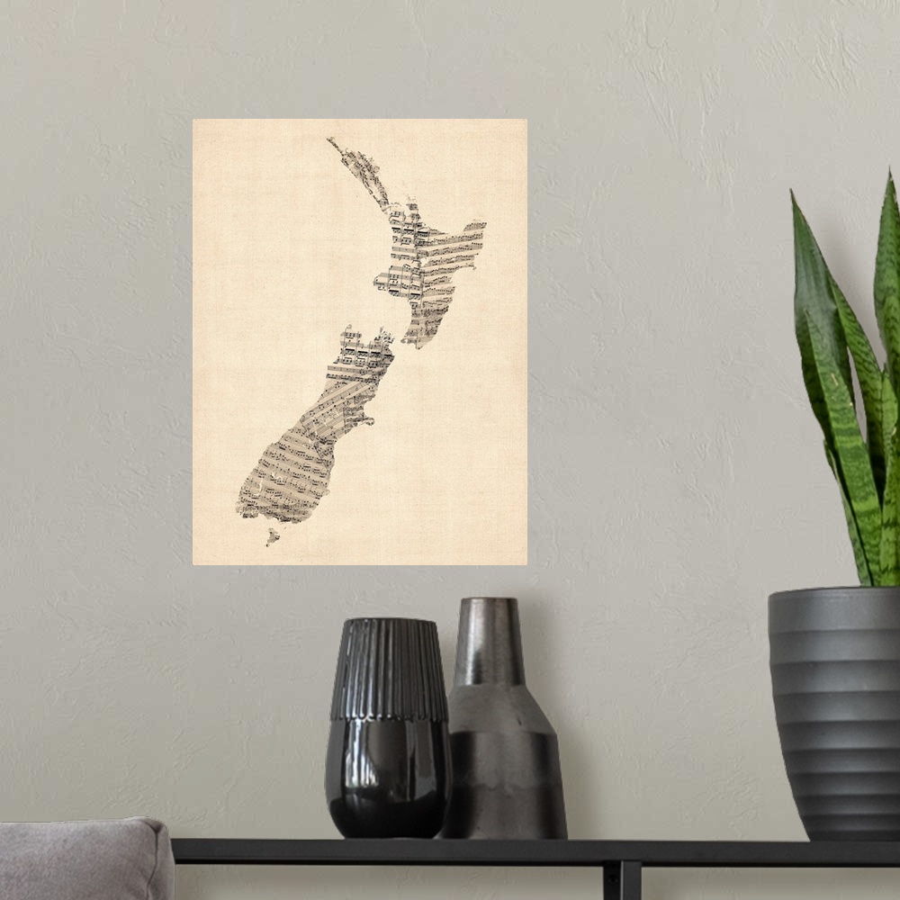 A modern room featuring A map of New Zealand made from a collage of old and vintage sheet music, including some handwritt...