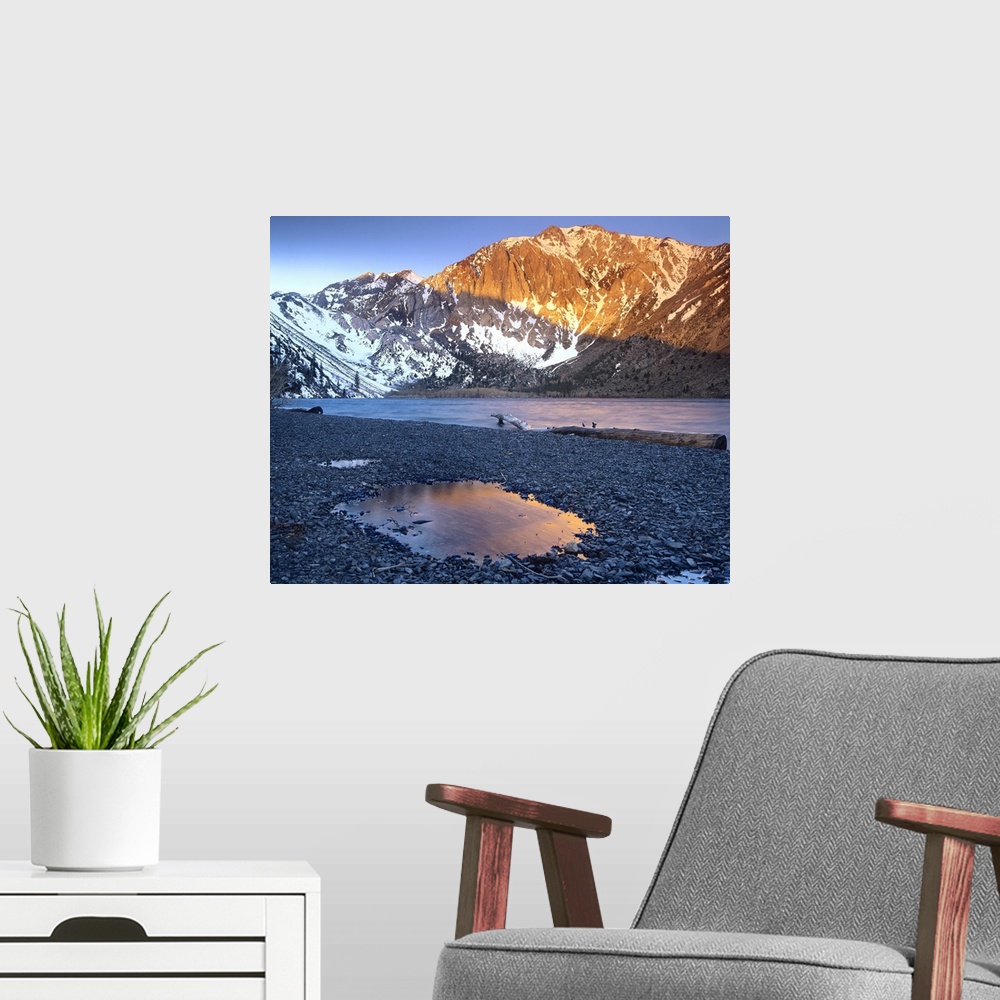 A modern room featuring Laurel Mountain dusted with snow overlooking Convict Lake, Sierra Nevada, California