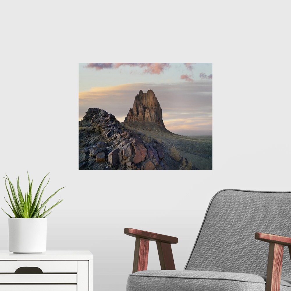 A modern room featuring Ship Rock at sunset, remnant basalt core of extinct volcano, New Mexico