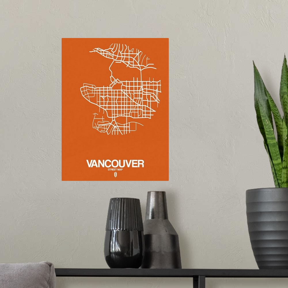A modern room featuring Minimalist art map of the city streets of Vancouver in orange and white.