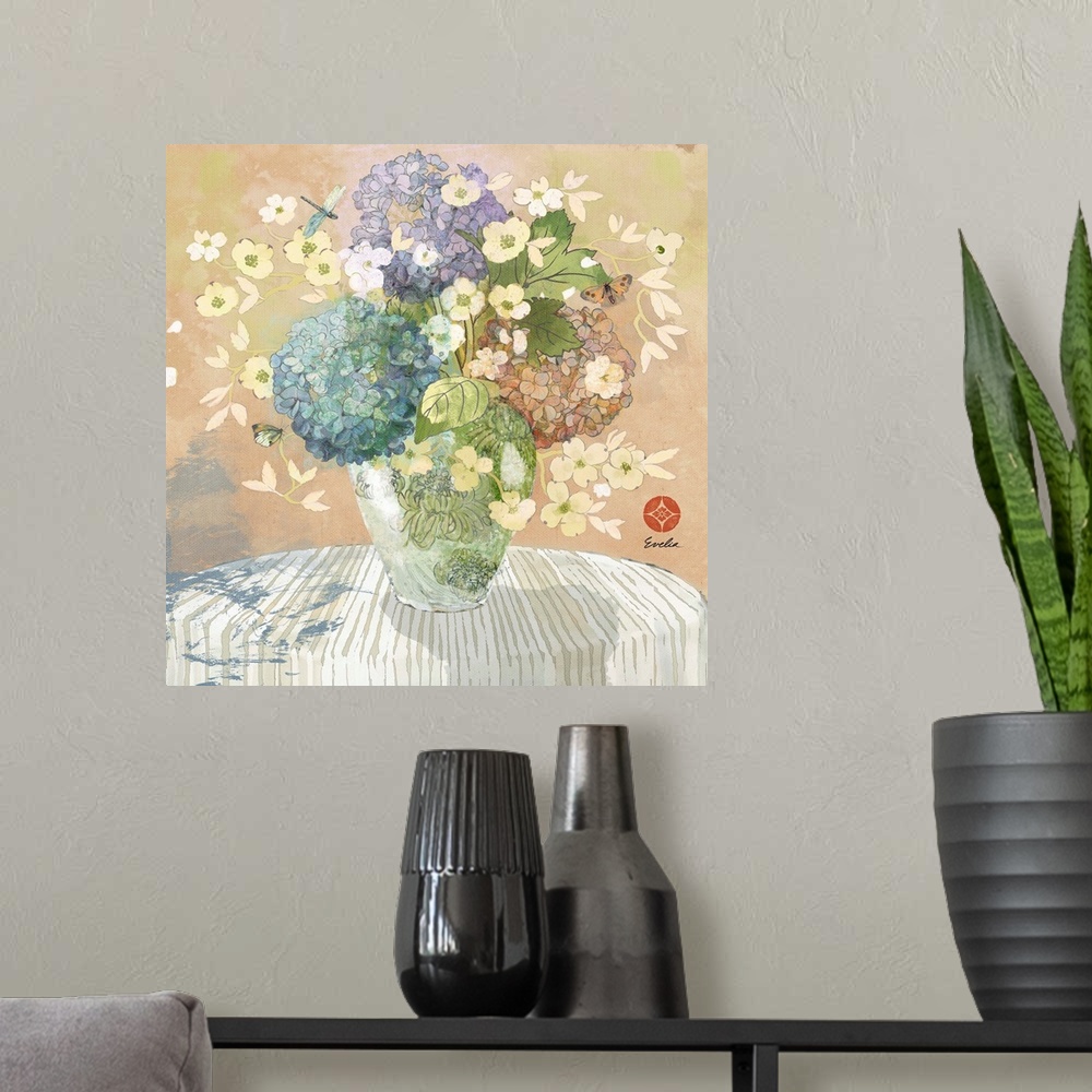 A modern room featuring Artwork of beautiful flowers in a vase on a table.