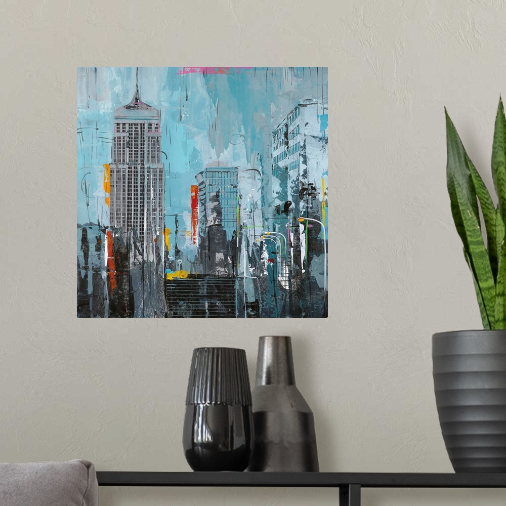 A modern room featuring Contemporary artwork of New York skyscrapers with pops of bright contrasting colors.
