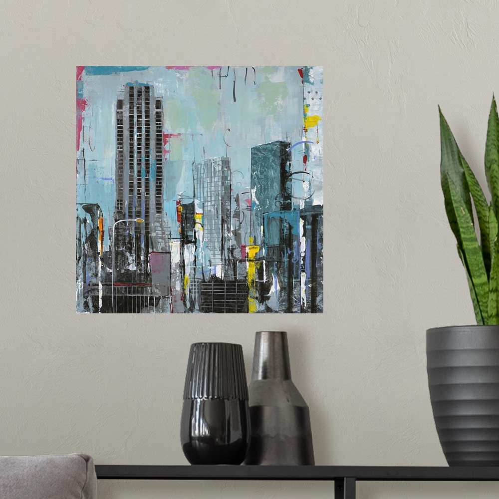 A modern room featuring Contemporary artwork of New York skyscrapers with pops of bright contrasting colors.