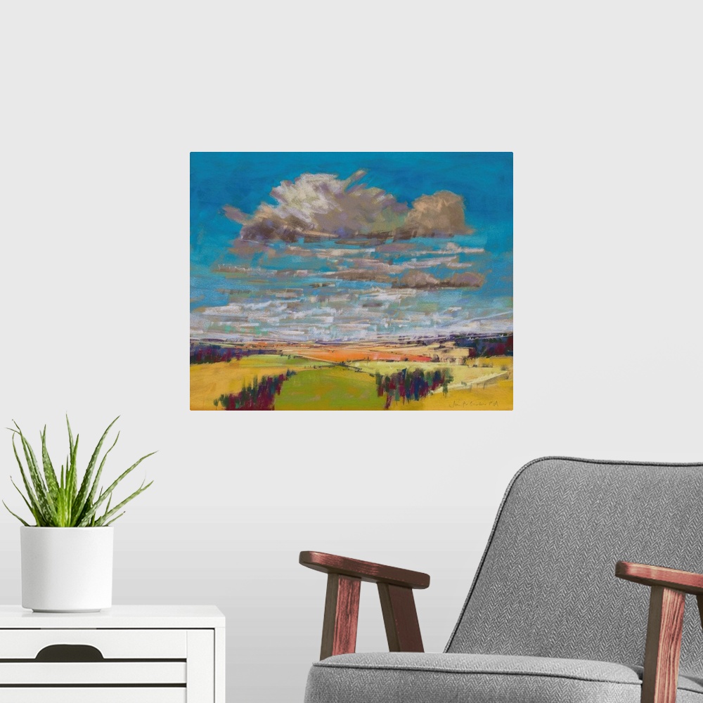 A modern room featuring Pastel landscape painting of English countryside with trees, fields and clouds.