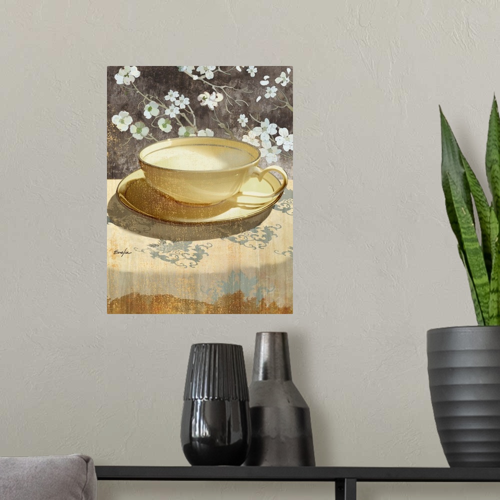 A modern room featuring Contemporary artwork of a golden teacup sitting on a floral tablecloth.