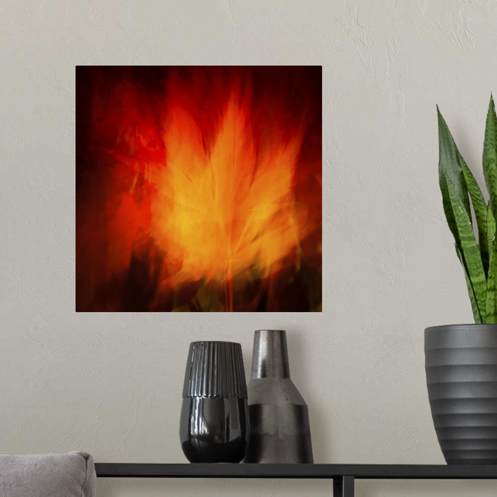 A modern room featuring Virbrant fiery maple leaf abstract in red and gold.