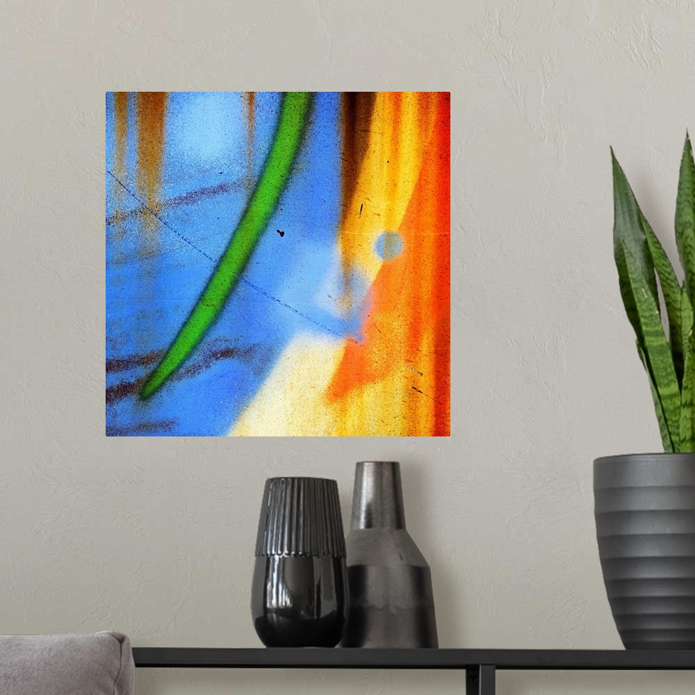 A modern room featuring Abstract artwork created from a close up shot of graffiti on a wall, with curved streaks of blue,...