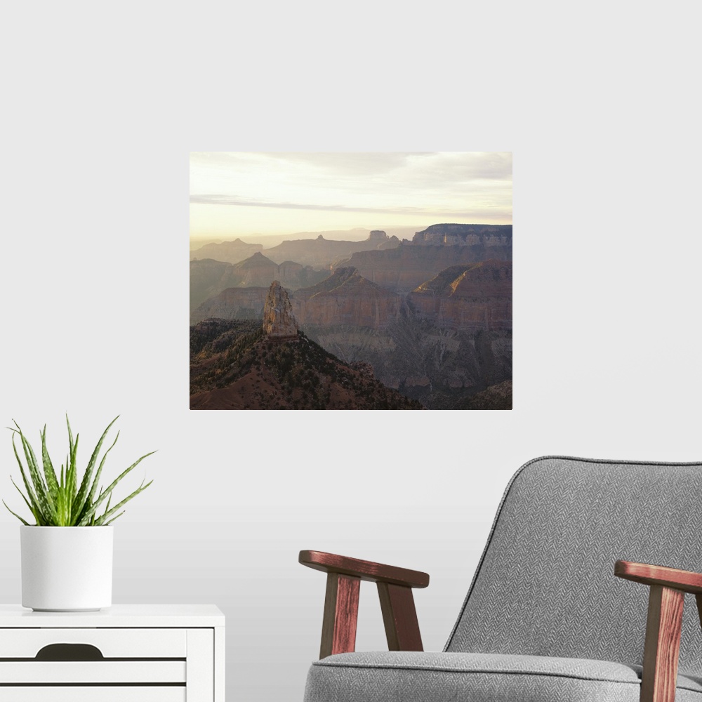 A modern room featuring Landscape photograph on a large canvas looking over the vast mountain range in Grand Canyon Natio...