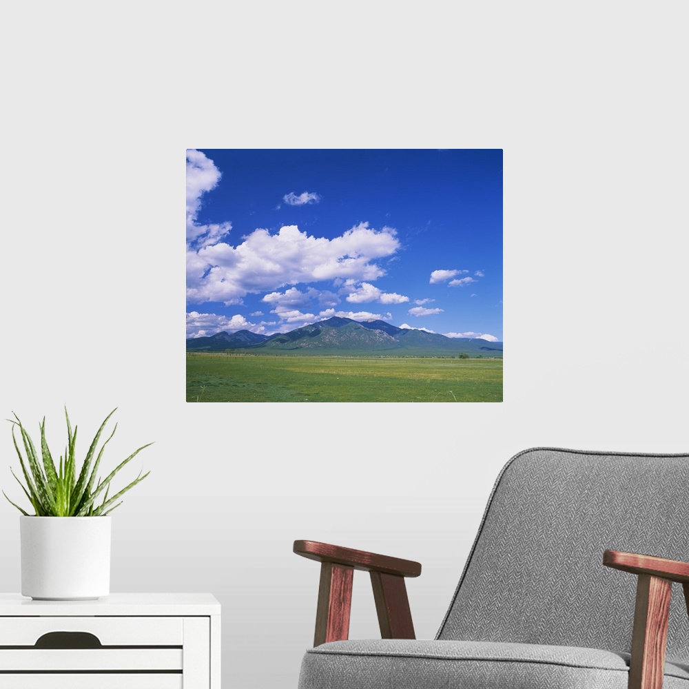 A modern room featuring Clouds over a mountain range, Taos, Taos County, New Mexico
