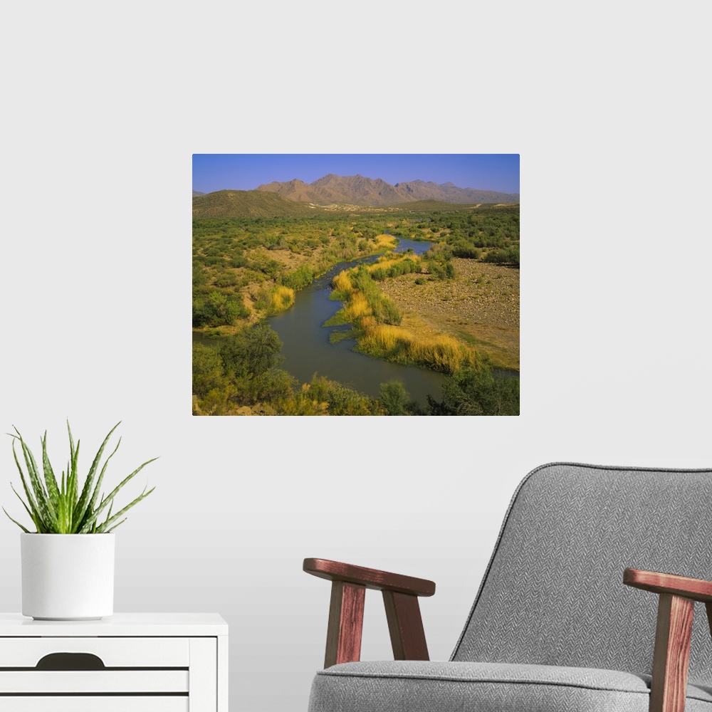A modern room featuring High angle view of a river passing through a landscape, Verde River, Mazatzal Mountains, Tonto Na...