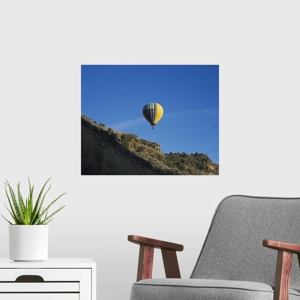 A modern room featuring Low angle view of a hot air balloon in the sky, Taos County, New Mexico