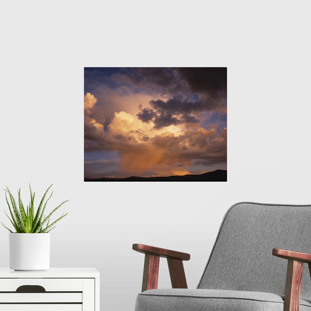 A modern room featuring Rain and storm clouds over Colorado on a summer's evening.