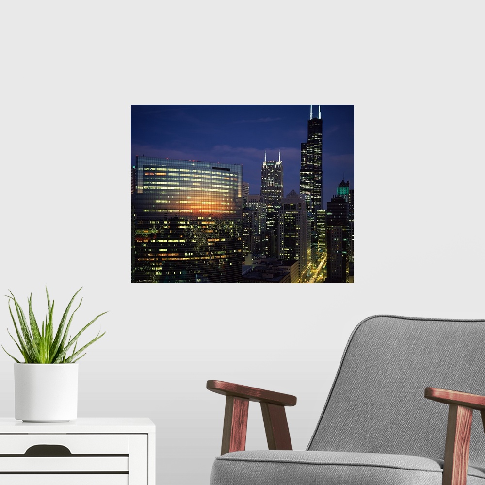 A modern room featuring Skyscrapers lit up at night, Chicago, Cook County, Illinois,