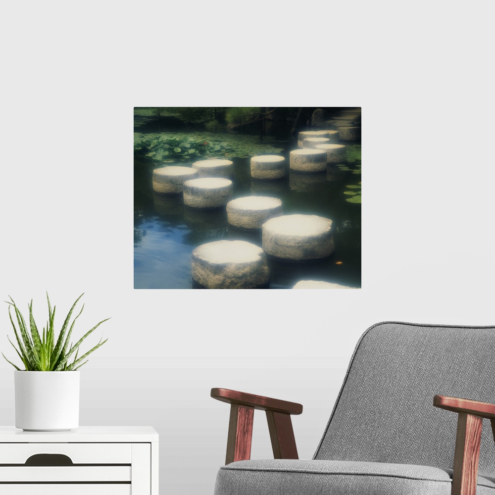 A modern room featuring Large photo of a walkway of rocks across the water in a Japanese garden in Kyoto, Japan.