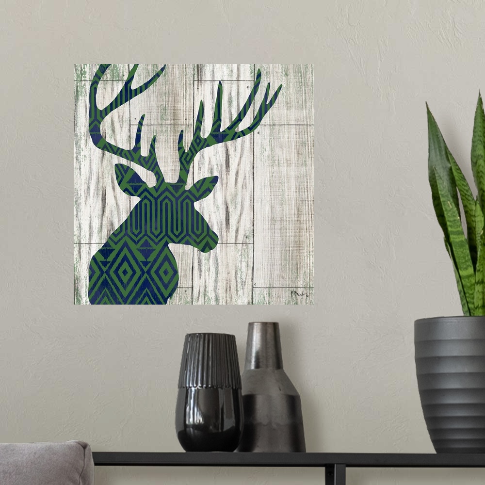 A modern room featuring Square cabin decor with a blue and green patterned silhouette of a deer on a faux distressed wood...