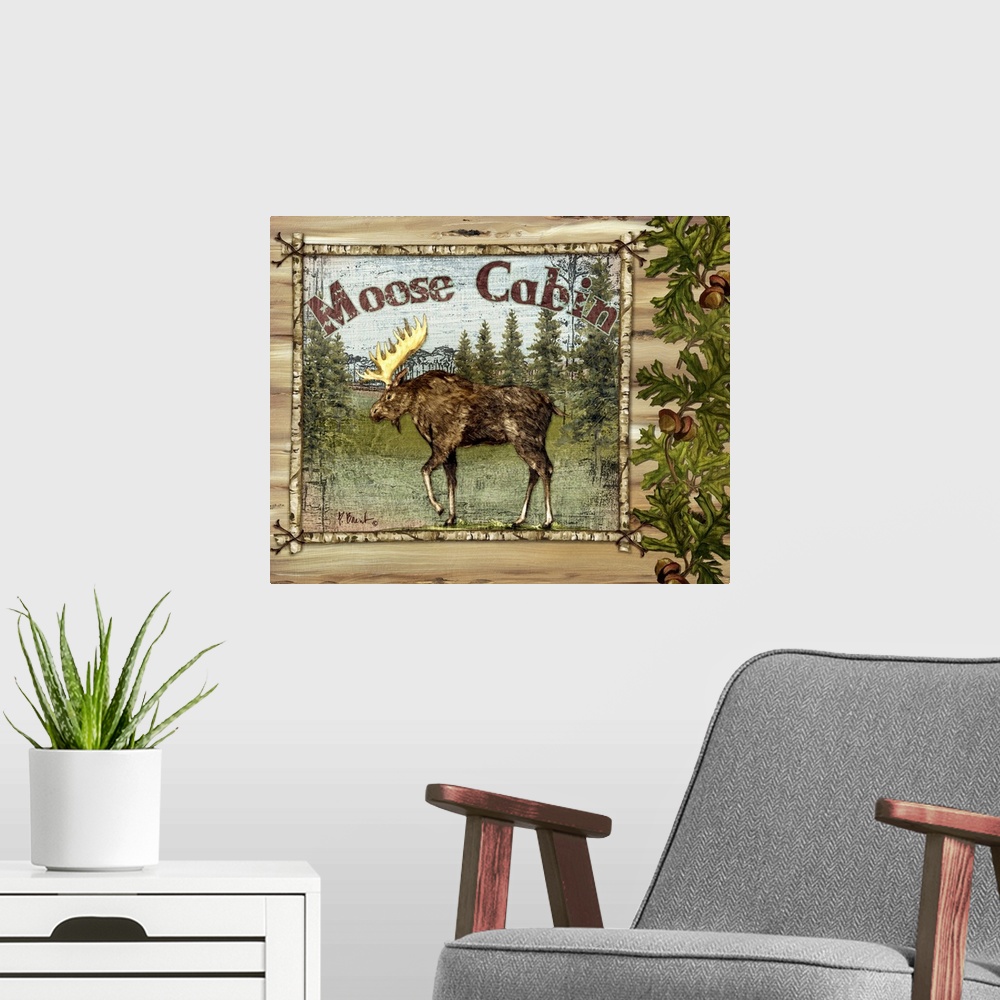 A modern room featuring Decorative artwork of a moose in a frame, with oak leaves, acorns, and the words Moose Cabin.