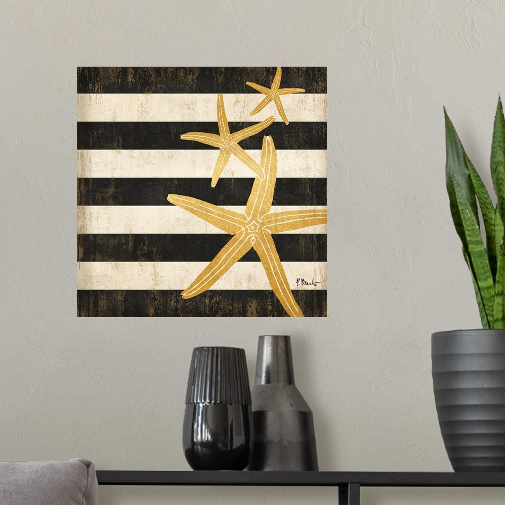 A modern room featuring Square decor with metallic gold starfish on a black and white striped background.