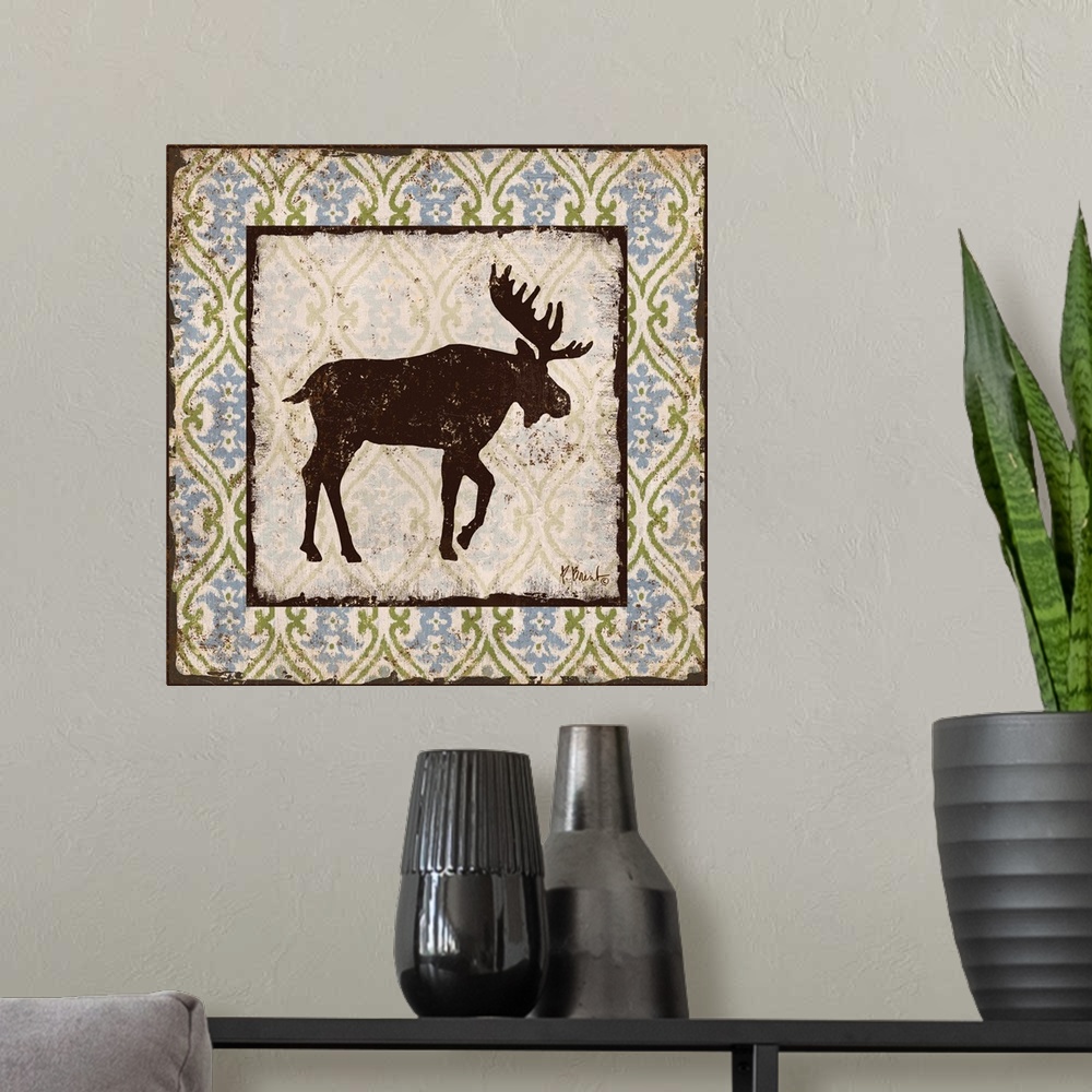 A modern room featuring Decorative square artwork featuring a silhouetted moose on a boho pattern.