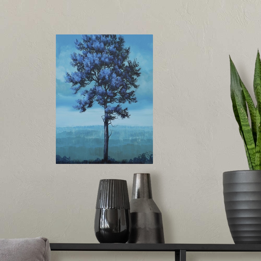 A modern room featuring Contemporary artwork of a tall tree in a field in shades of blue.