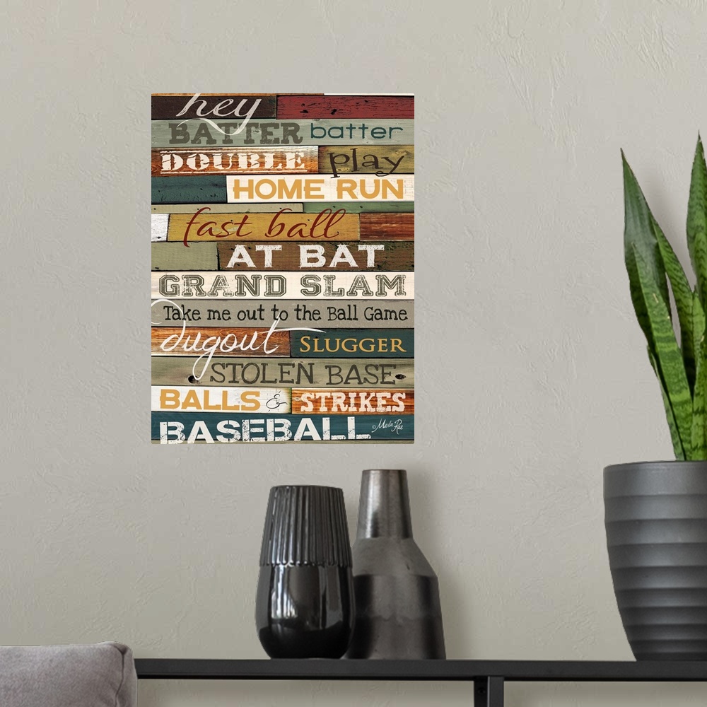 A modern room featuring Typography home decor art, with text in different fonts against a colorful wooden surface.