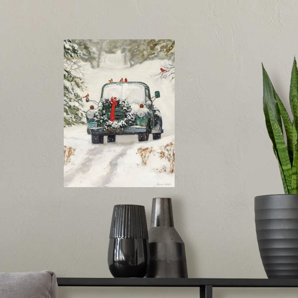 A modern room featuring A truck with a Christmas wreath sitting in the snow in a forest.