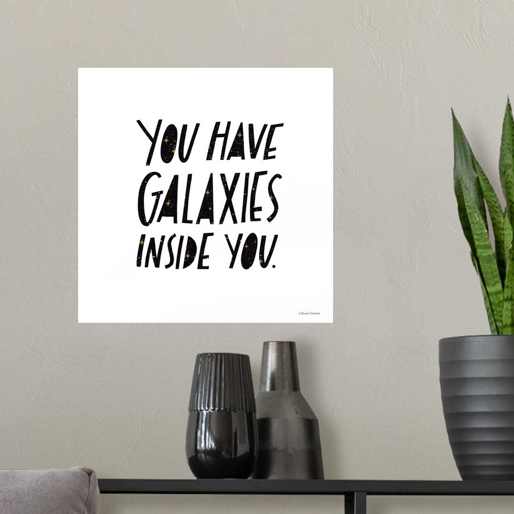 A modern room featuring You Have Galaxies Inside You