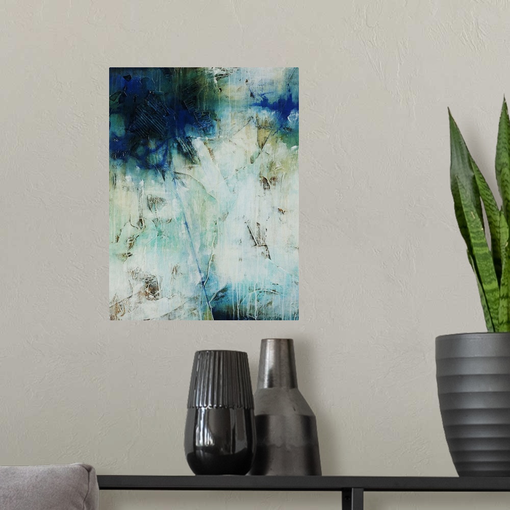 A modern room featuring Abstract art of a large mass of cool colors at the top, with a single line of blue that leads dow...