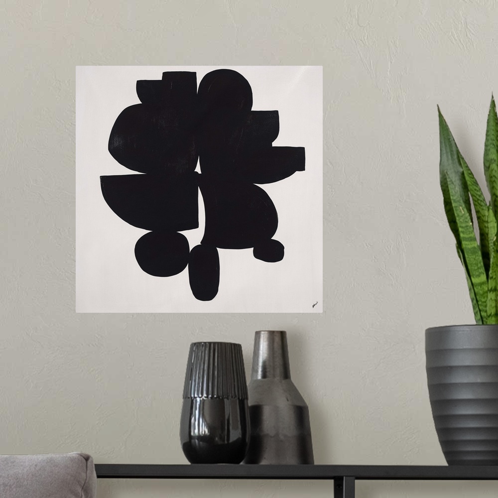 A modern room featuring Abstract painting using heavy black paint to make shapes, almost appearing as something in silhou...