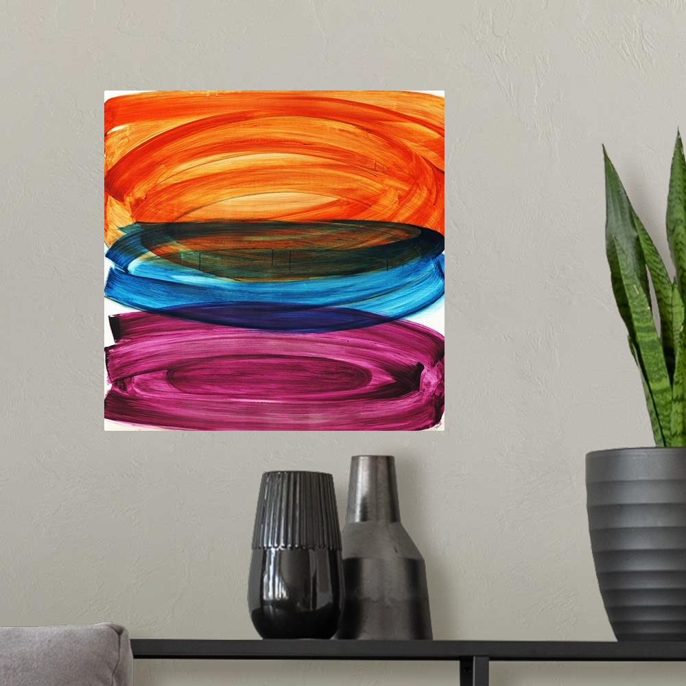 A modern room featuring Abstract painting of three large oval shapes that are vertically stacked, each in a different col...