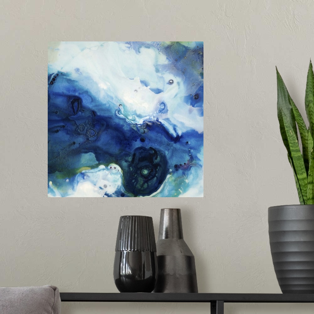 A modern room featuring Abstract art of a large swirling mass in cool tones that creates a feeling of colored sand moving...