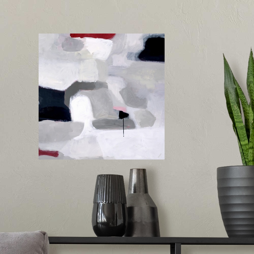 A modern room featuring Abstract square painting of shades of gray with accent colors of red and black.