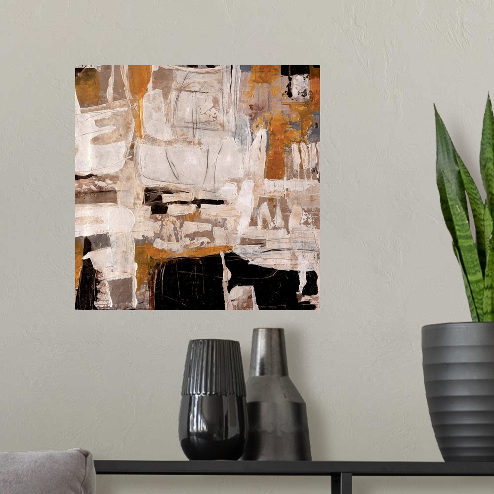 A modern room featuring Abstract artwork that is mostly off white with chunks of black and tan thrown in.